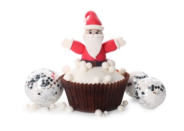 Tasty cupcake with Santa Claus and Christmas decor on white background