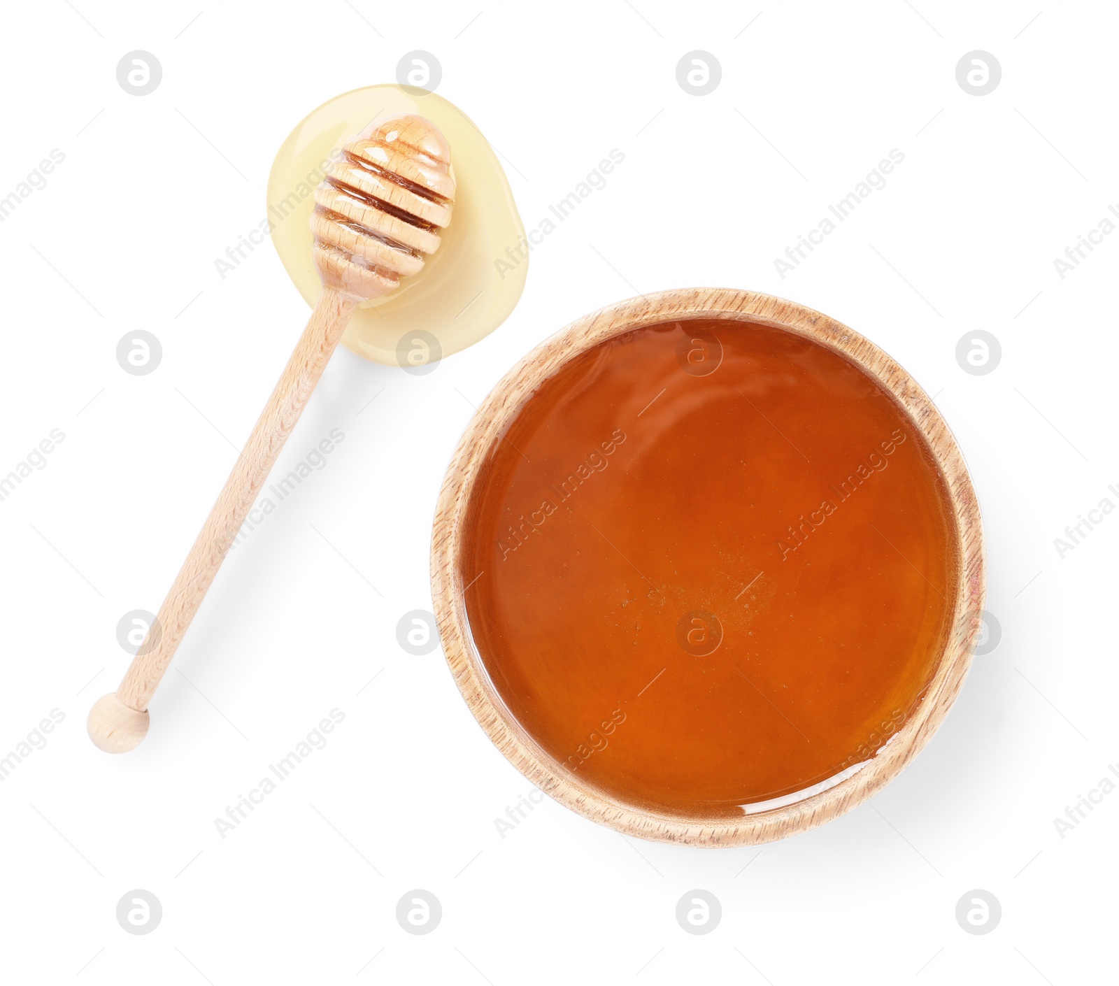 Photo of Tasty honey in bowl and dipper isolated on white, top view