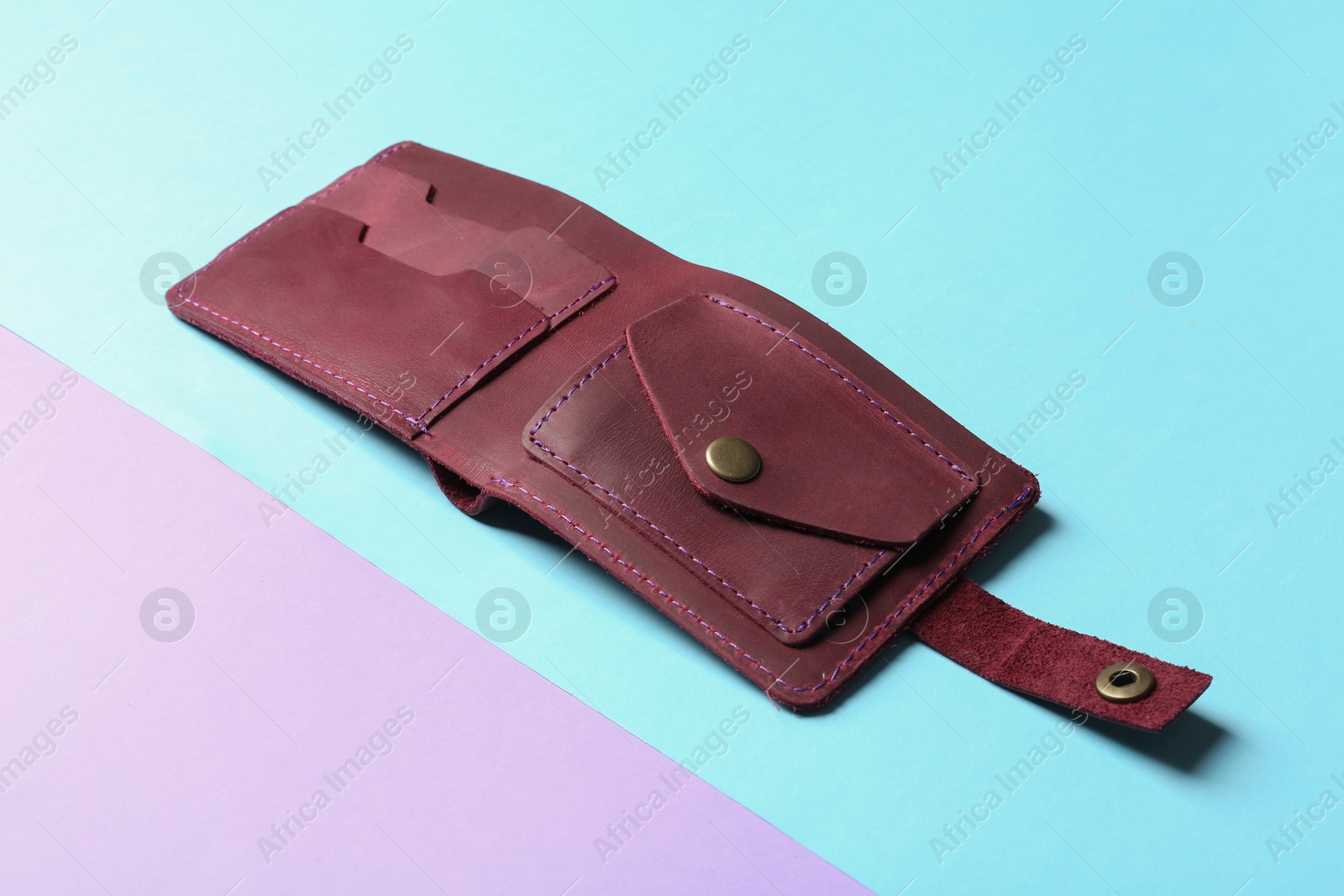 Photo of Leather wallet on color background. Stylish accessory