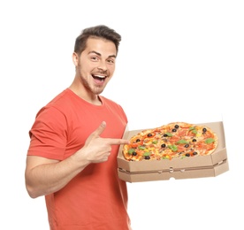 Photo of Attractive young man with delicious pizza on white background