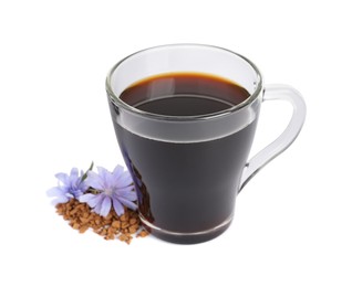 Glass cup of delicious chicory drink, granules and flowers on white background