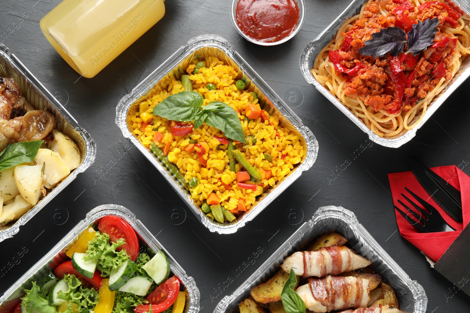 Photo of Lunchboxes on grey table, flat lay. Healthy food delivery