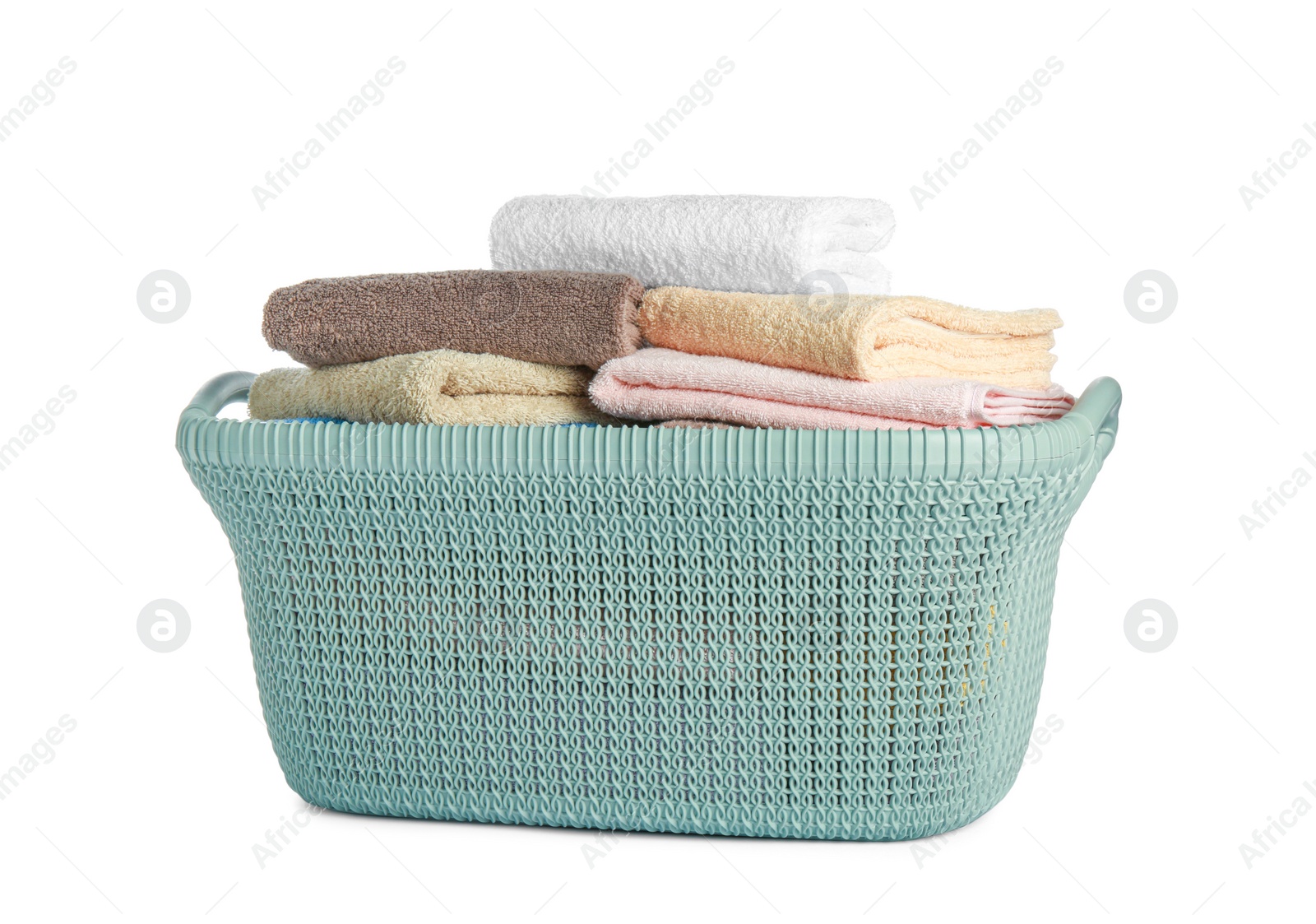 Photo of Plastic laundry basket with clean terry towels isolated on white