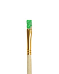 Photo of Brush with green paint on white background