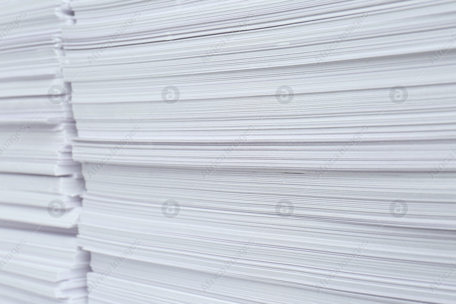 Photo of Stacks of white paper sheets, closeup view