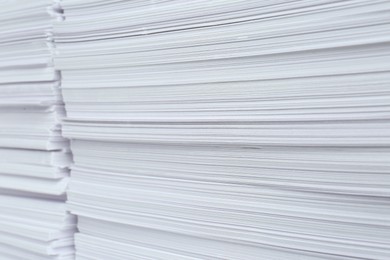 Photo of Stacks of white paper sheets, closeup view