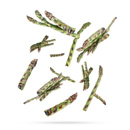 Grilled asparagus spears in air on white background