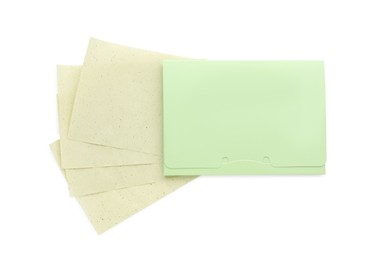 Photo of Package with facial oil blotting tissues on white background, top view. Mattifying wipes