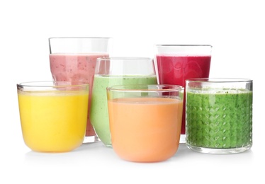 Photo of Glasses with delicious detox smoothies on white background