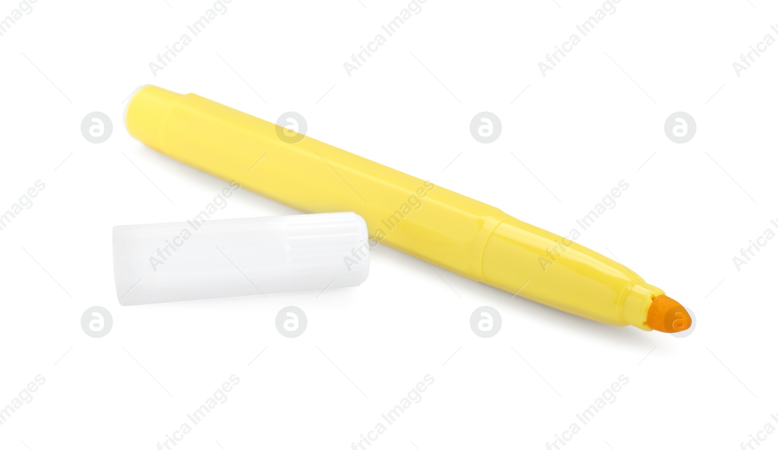 Photo of Bright yellow marker and cap isolated on white. School stationery