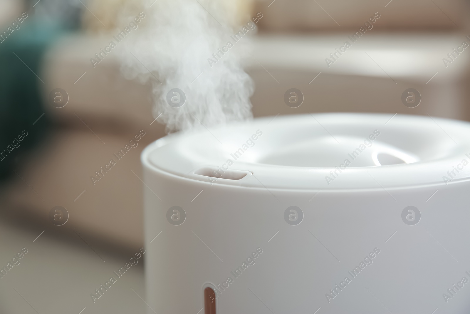 Photo of Modern air humidifier at home, closeup view