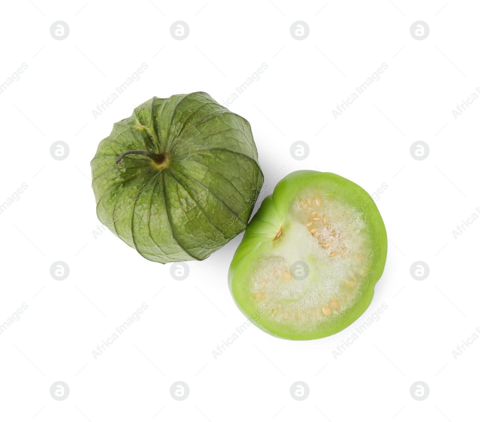 Photo of Fresh green tomatillos with husk isolated on white, top view