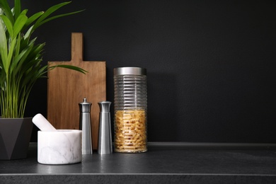 Photo of Composition with kitchenware on table against grey background. Space for text