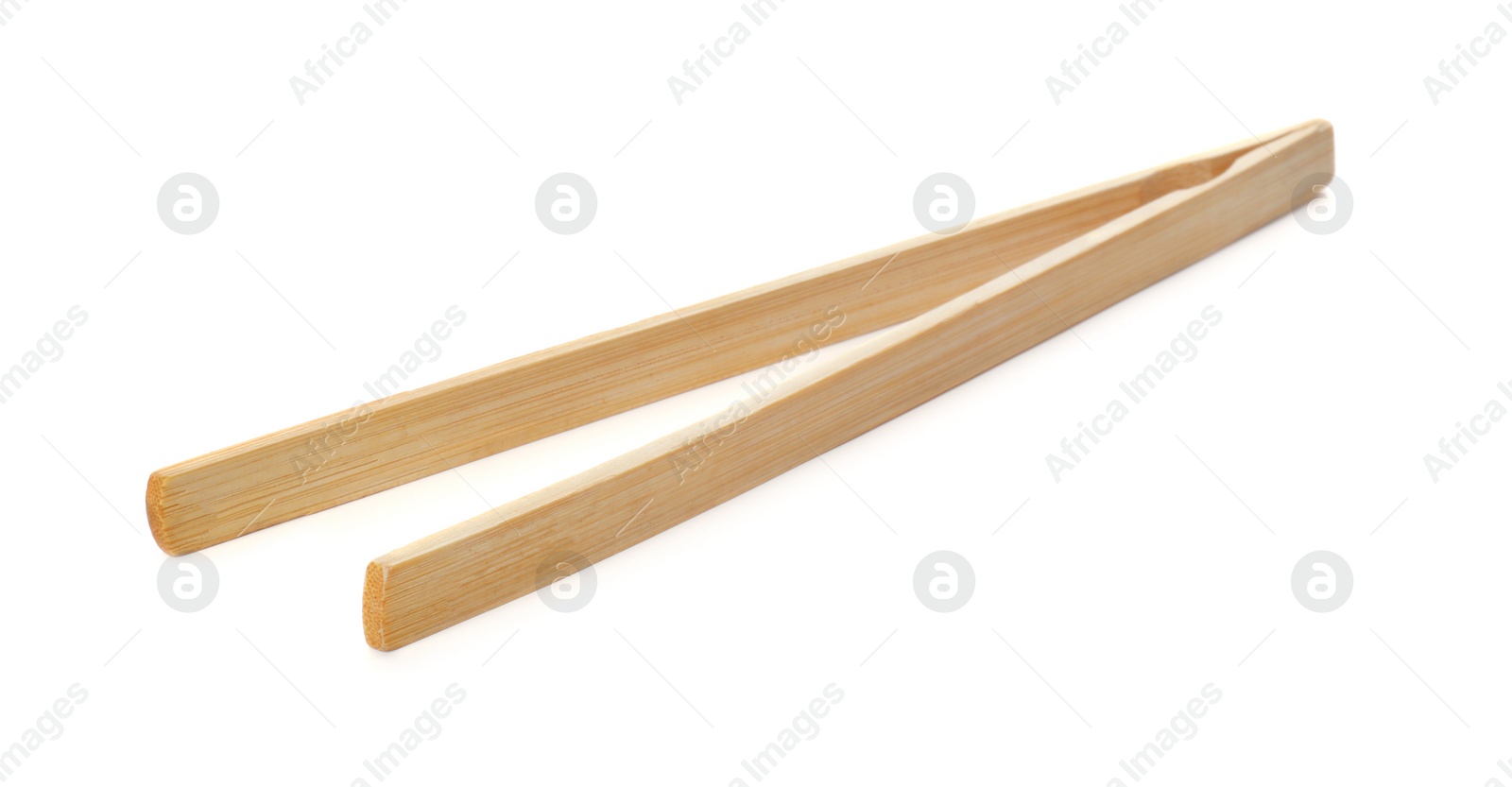 Photo of Tongs made of bamboo on white background