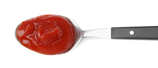 Photo of Tasty ketchup with spoon isolated on white, top view. Tomato sauce