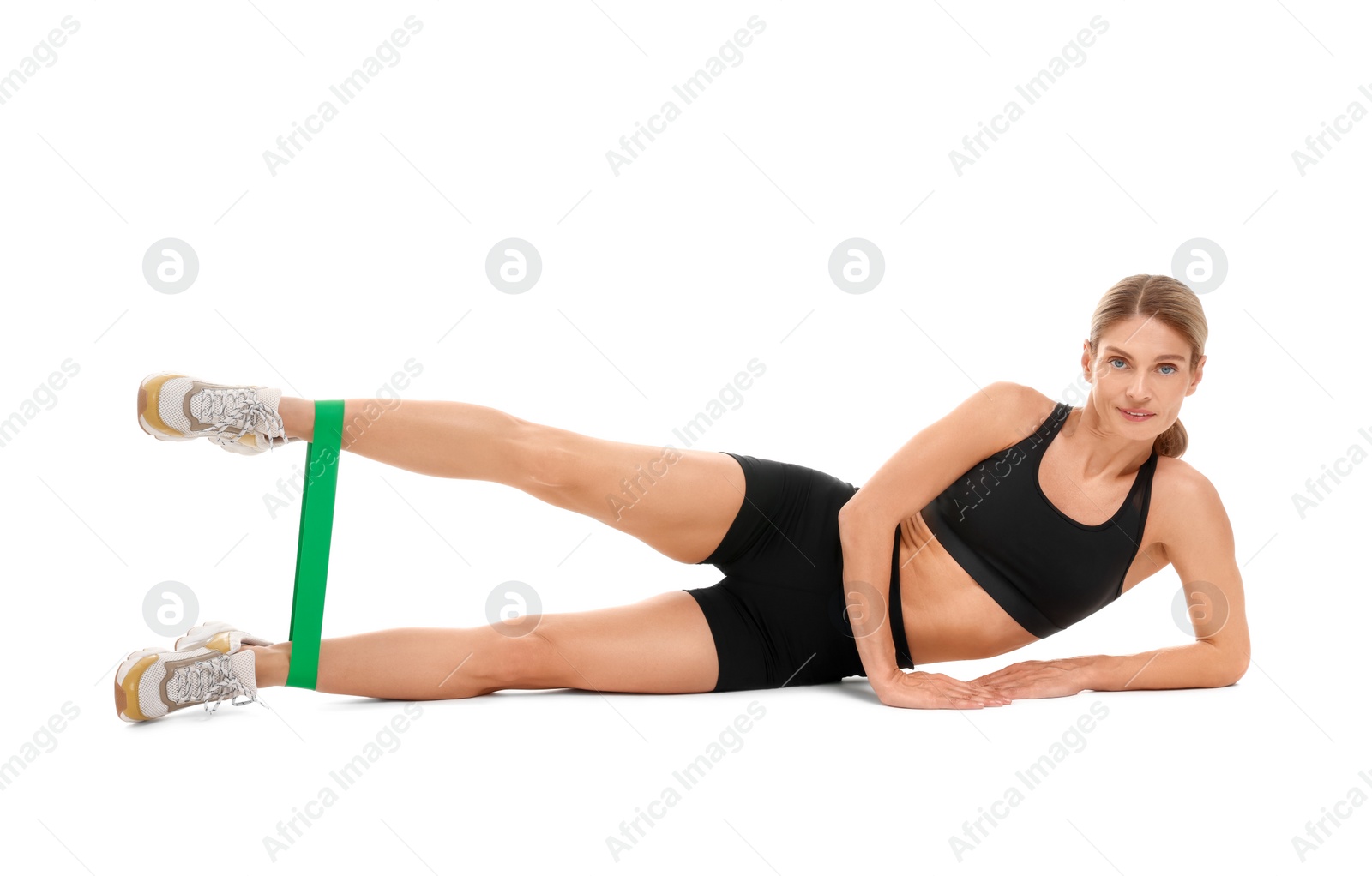 Photo of Woman exercising with elastic resistance band on white background