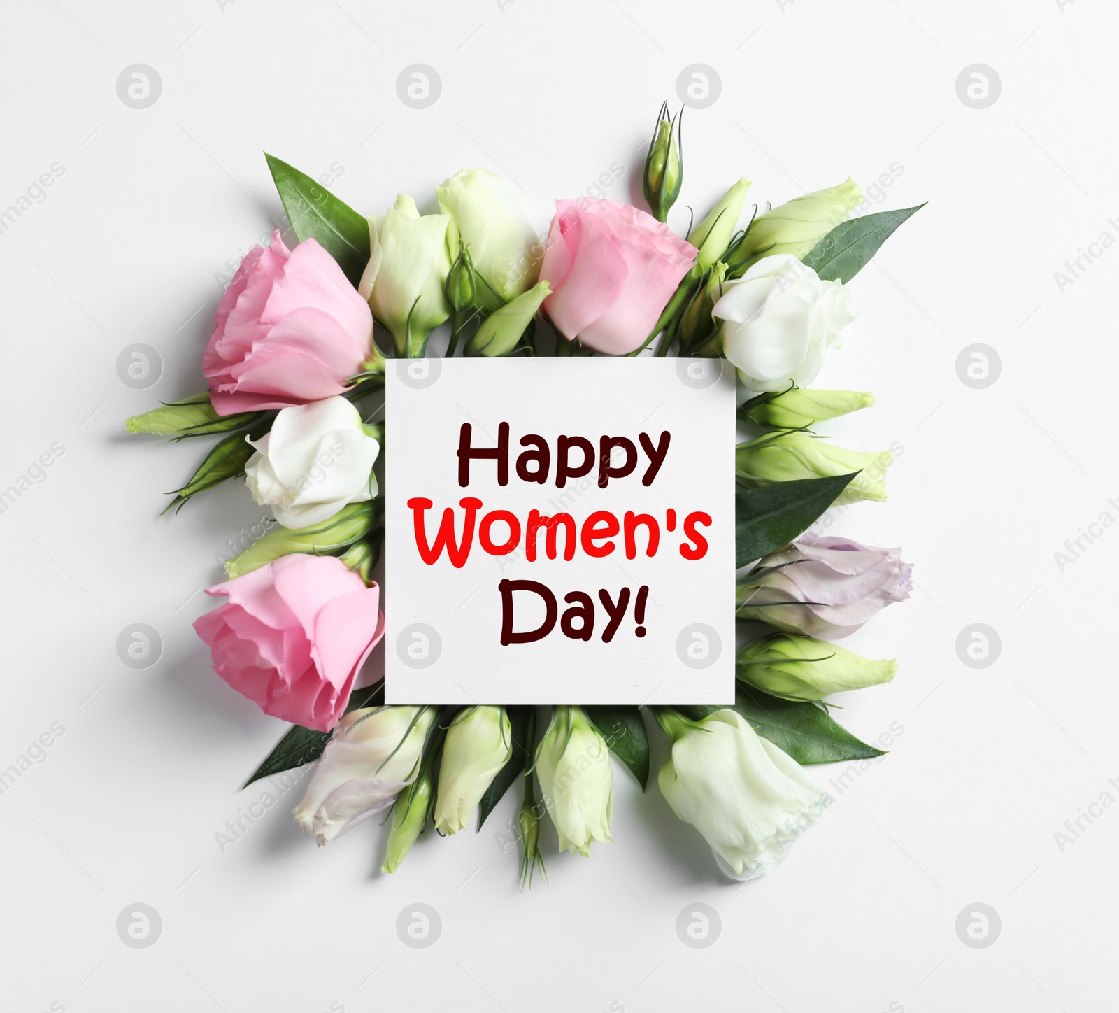 Image of Beautiful Eustoma flowers and card on white background, flat lay. Happy Women's Day