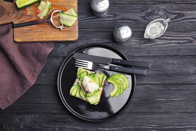 Photo of Tasty breakfast with crisp avocado  toast on table, top view