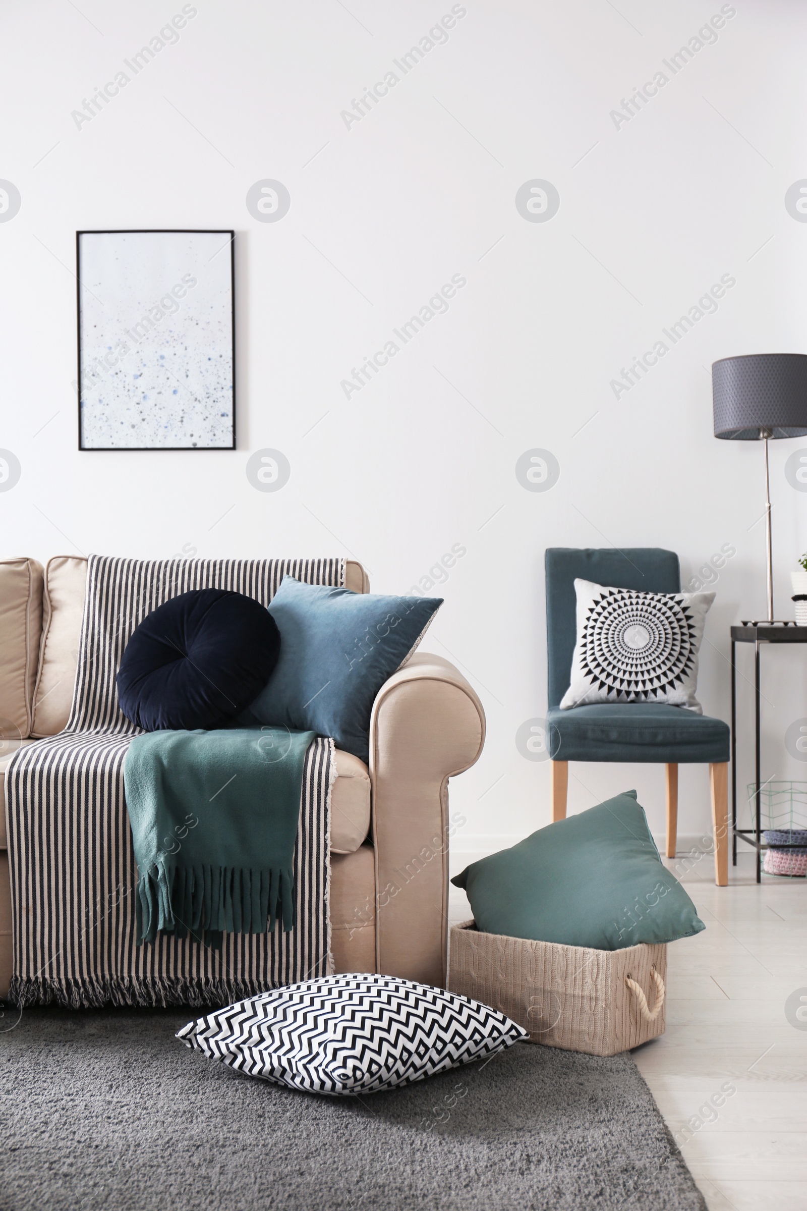 Photo of Living room interior with comfortable sofa and pillows