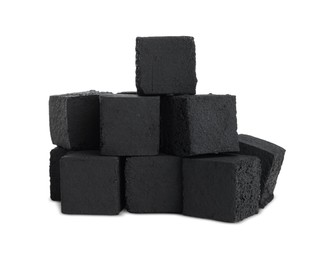 Photo of Stack of charcoal cubes for hookah on white background