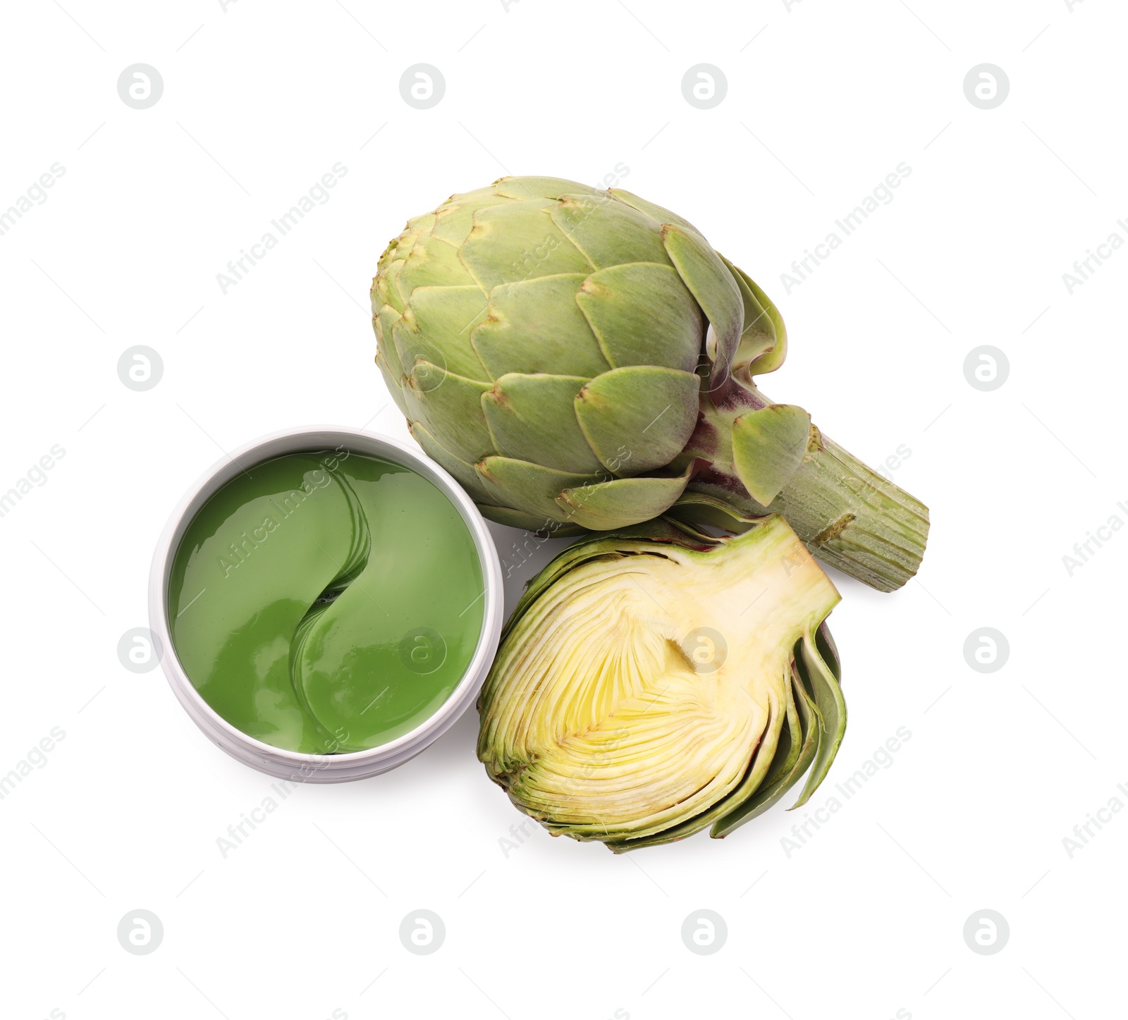 Photo of Package of under eye patches and artichokes on white background, top view. Cosmetic product