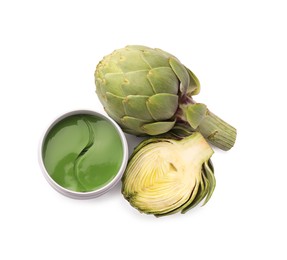 Package of under eye patches and artichokes on white background, top view. Cosmetic product