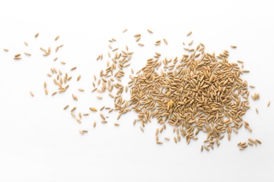 Photo of Raw rye on white background. Healthy grains and cereals