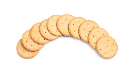 Tasty crispy round crackers isolated on white, top view