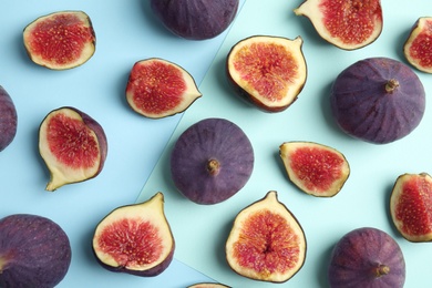 Photo of Delicious ripe figs on color background, flat lay