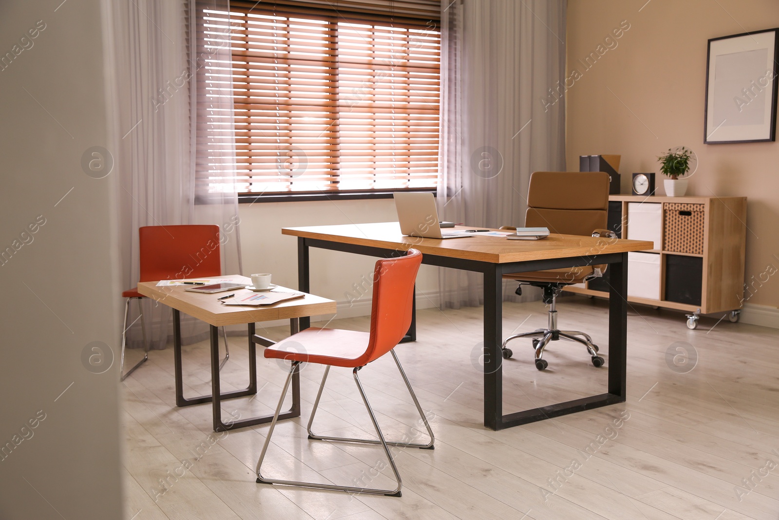 Photo of Director's office with large wooden table. Interior design