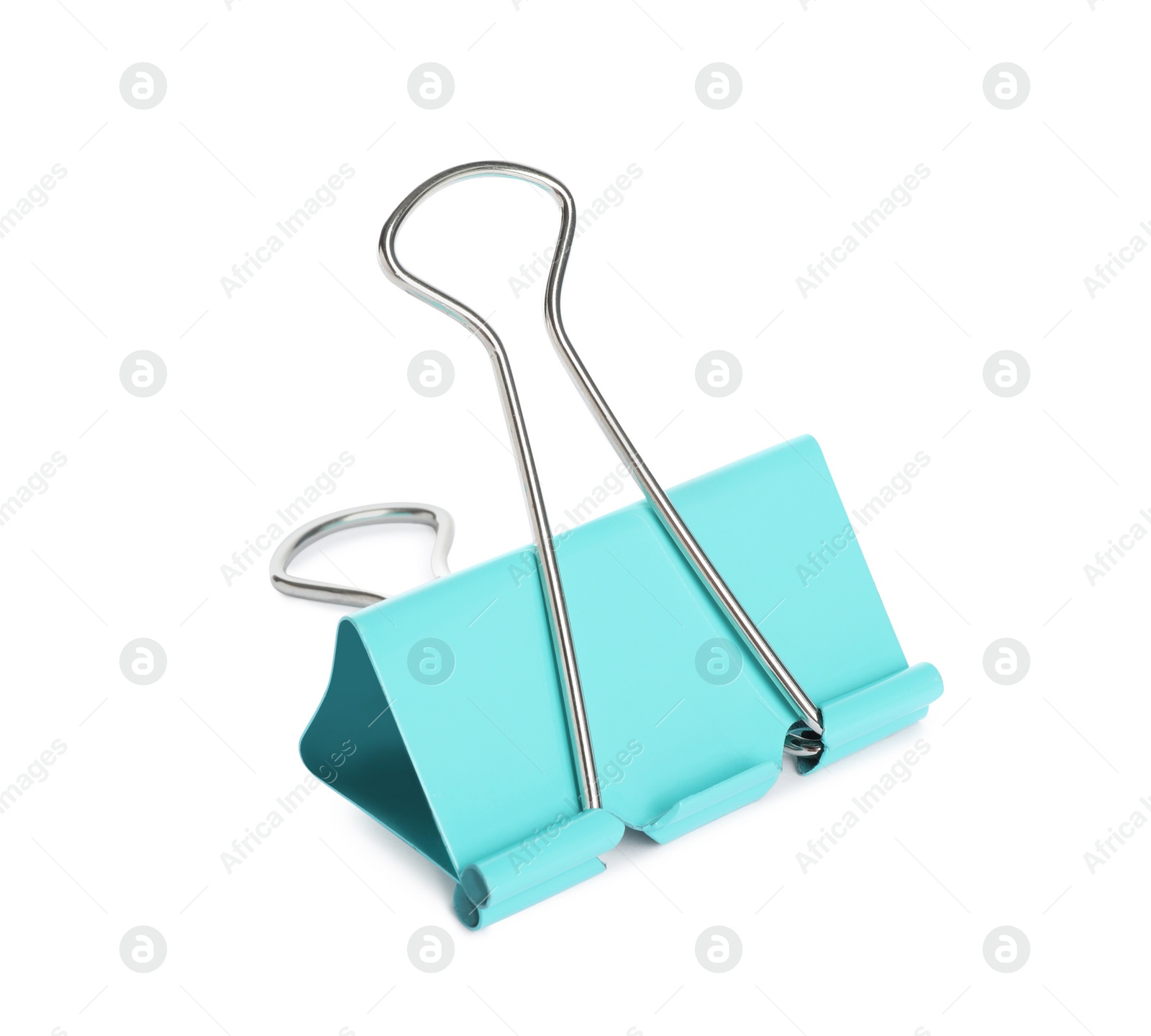 Photo of Turquoise binder clip isolated on white. Stationery