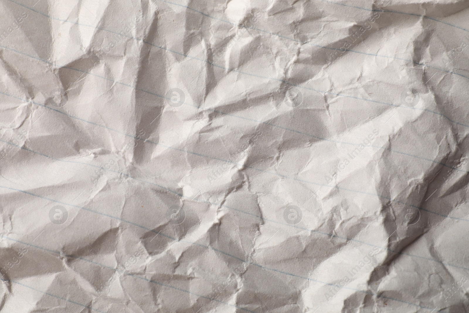 Photo of Crumpled sheet of paper as background, top view