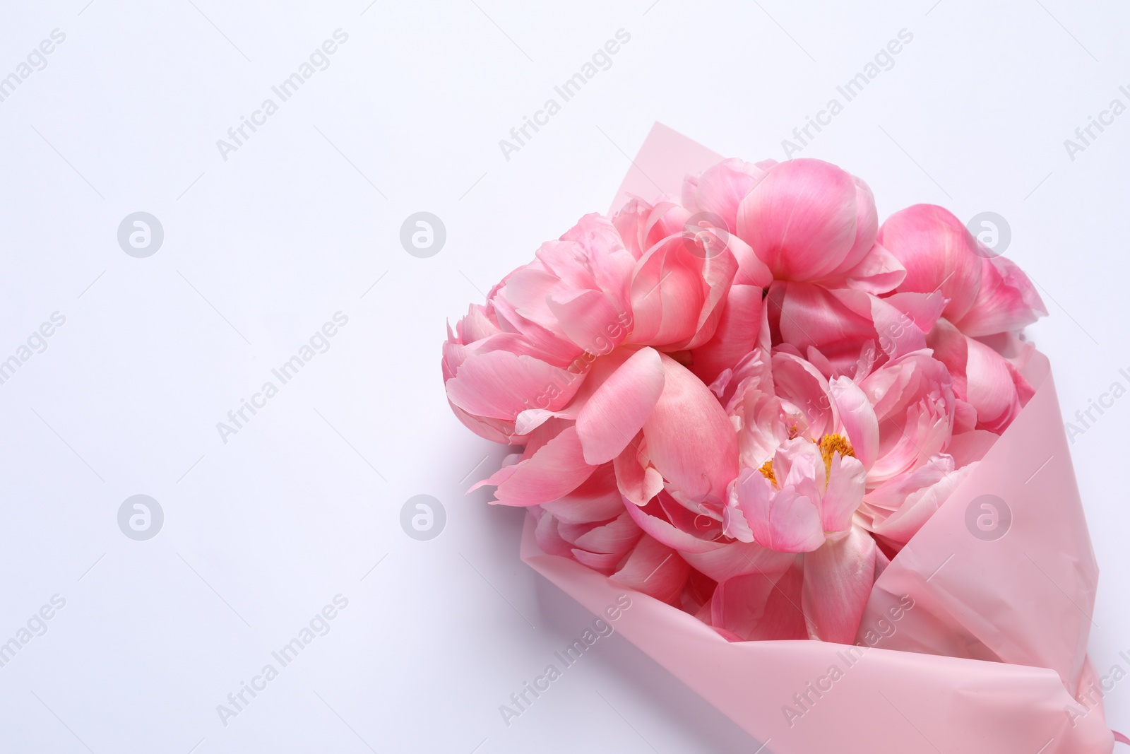 Photo of Beautiful bouquet of pink peonies on white background, top view