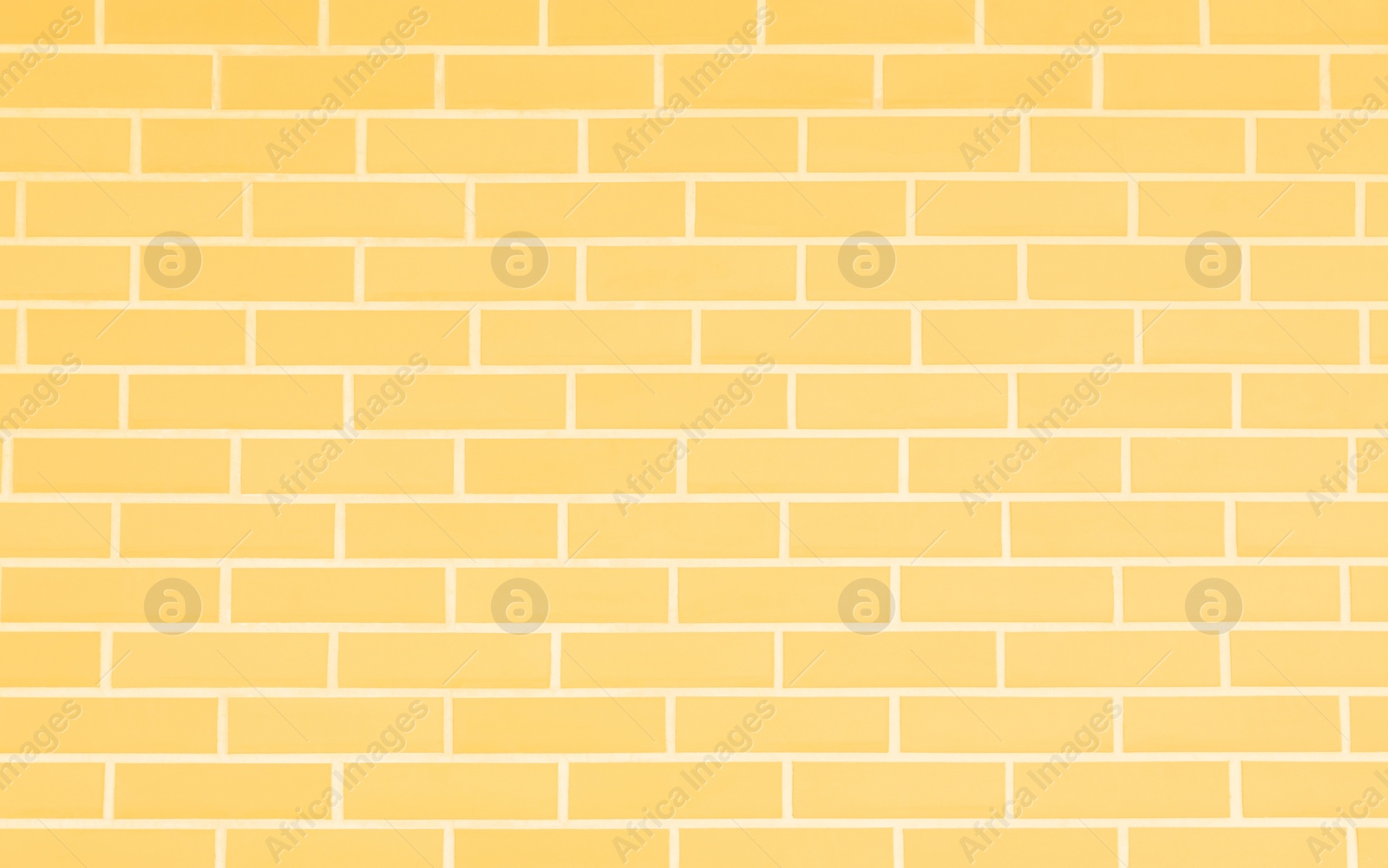Image of Texture of pale yellow color brick wall as background
