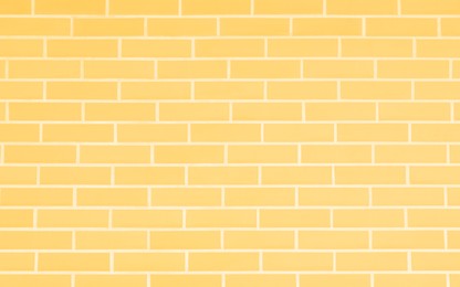 Image of Texture of pale yellow color brick wall as background