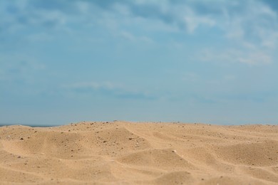 Photo of Closeup view of sandy beach on sunny day