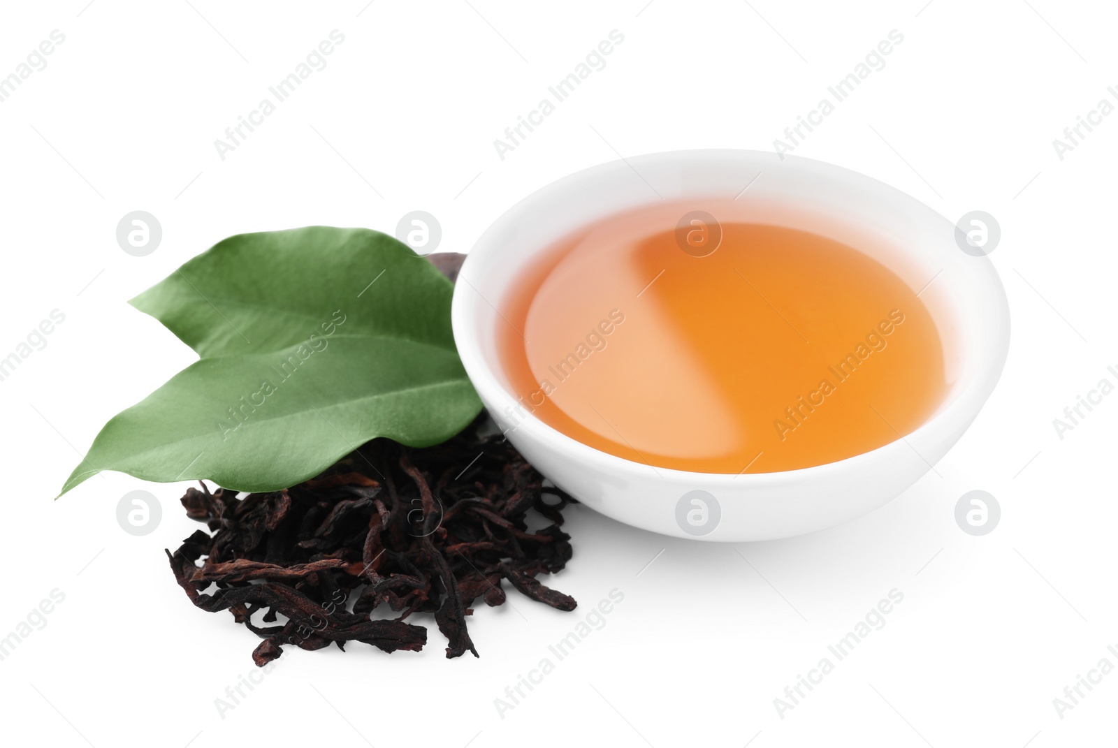 Photo of Traditional Chinese pu-erh tea, freshly brewed beverage and green leaves isolated on white