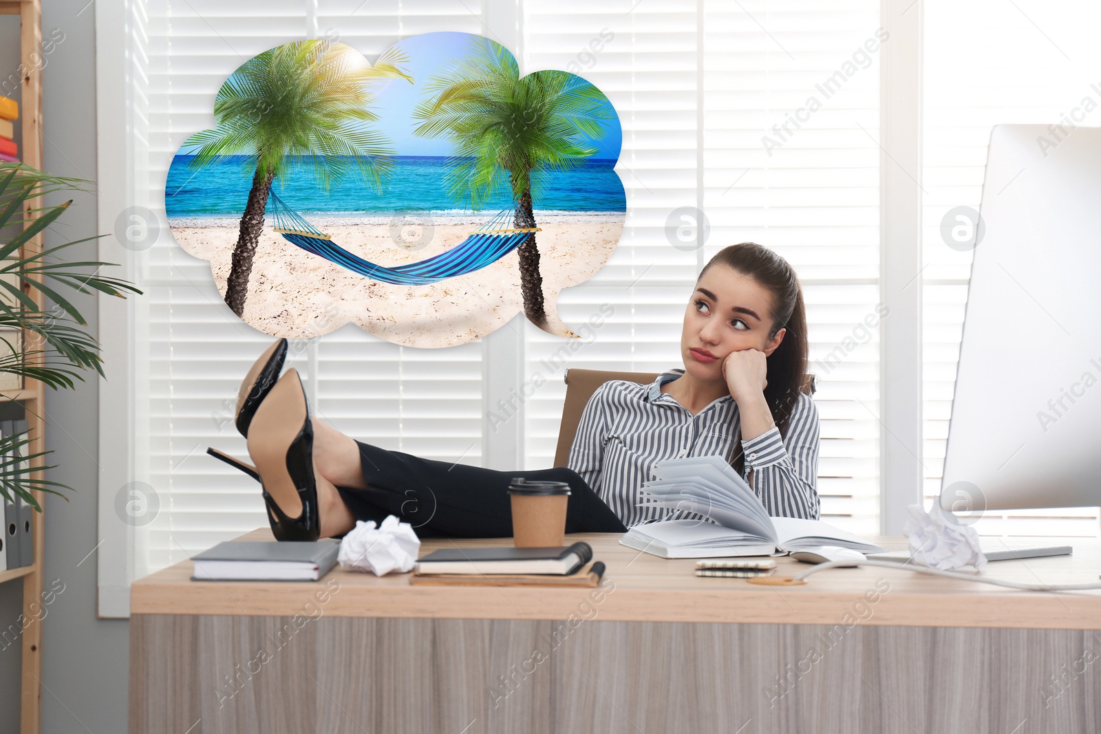 Image of Young woman dreaming about vacation at table in office