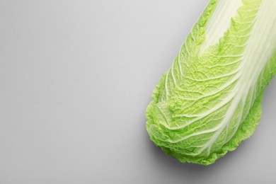 Photo of Fresh ripe Chinese cabbage on grey background, top view. Space for text