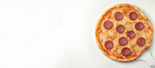 Image of Top viewhot delicious pizza on white table, space for text. Banner design 
