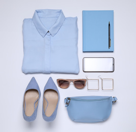 Photo of Flat lay composition with stylish clothes and accessories on white background