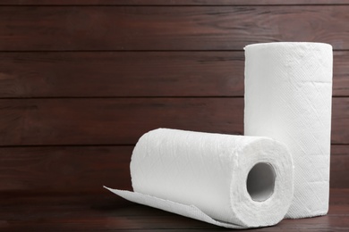 Rolls of paper towels on wooden table