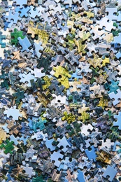 Photo of Jigsaw puzzle pieces on table, flat lay