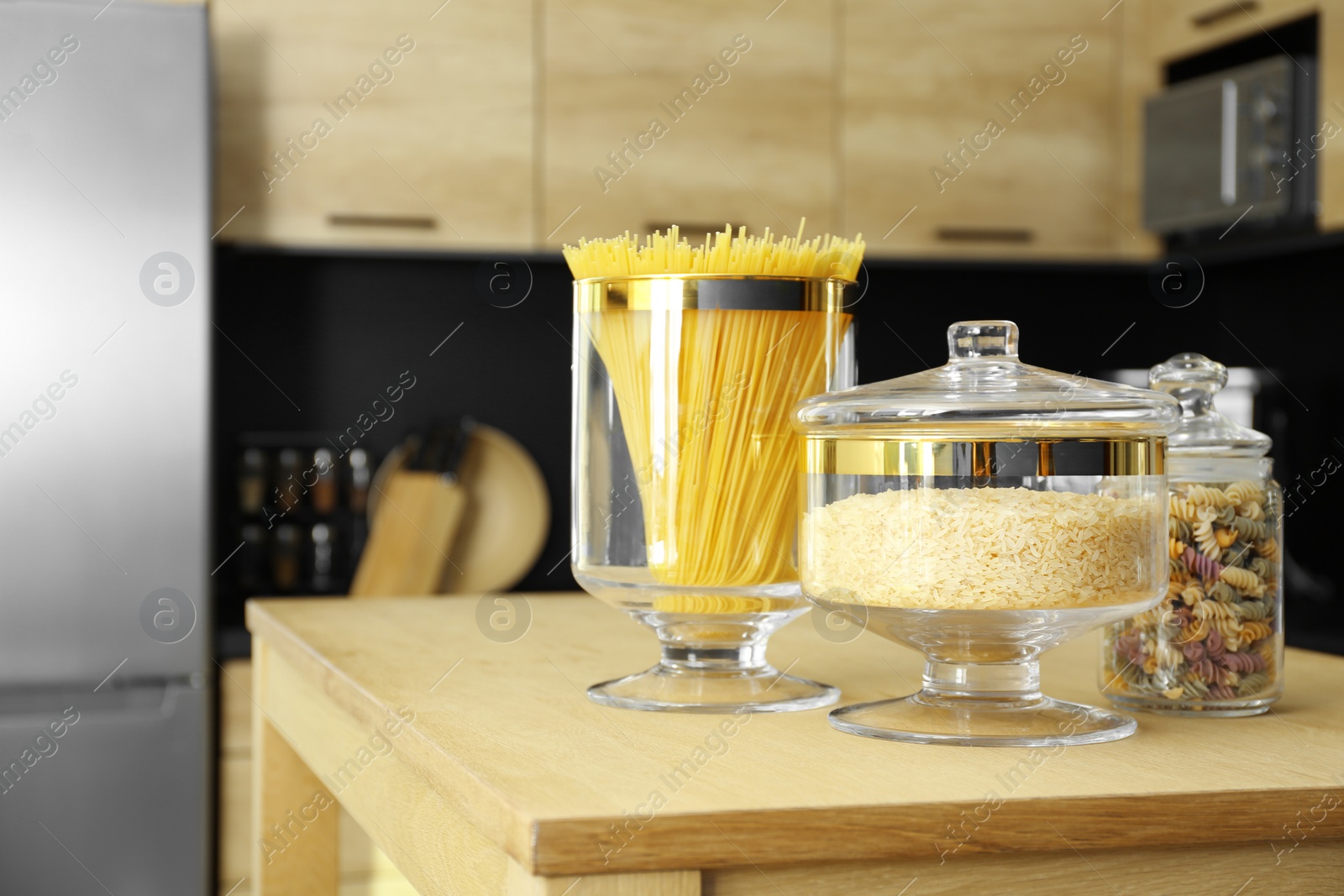 Photo of Products on wooden table in modern kitchen