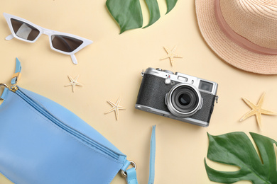 Photo of Flat lay composition with camera for professional photographer on beige background