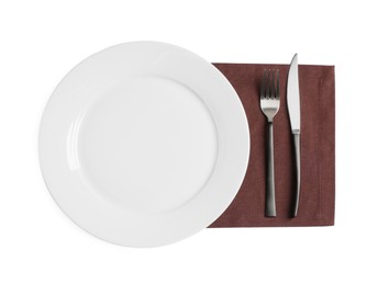 Empty plate, fork and knife on white background, top view