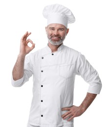 Photo of Happy chef in uniform showing OK gesture on white background