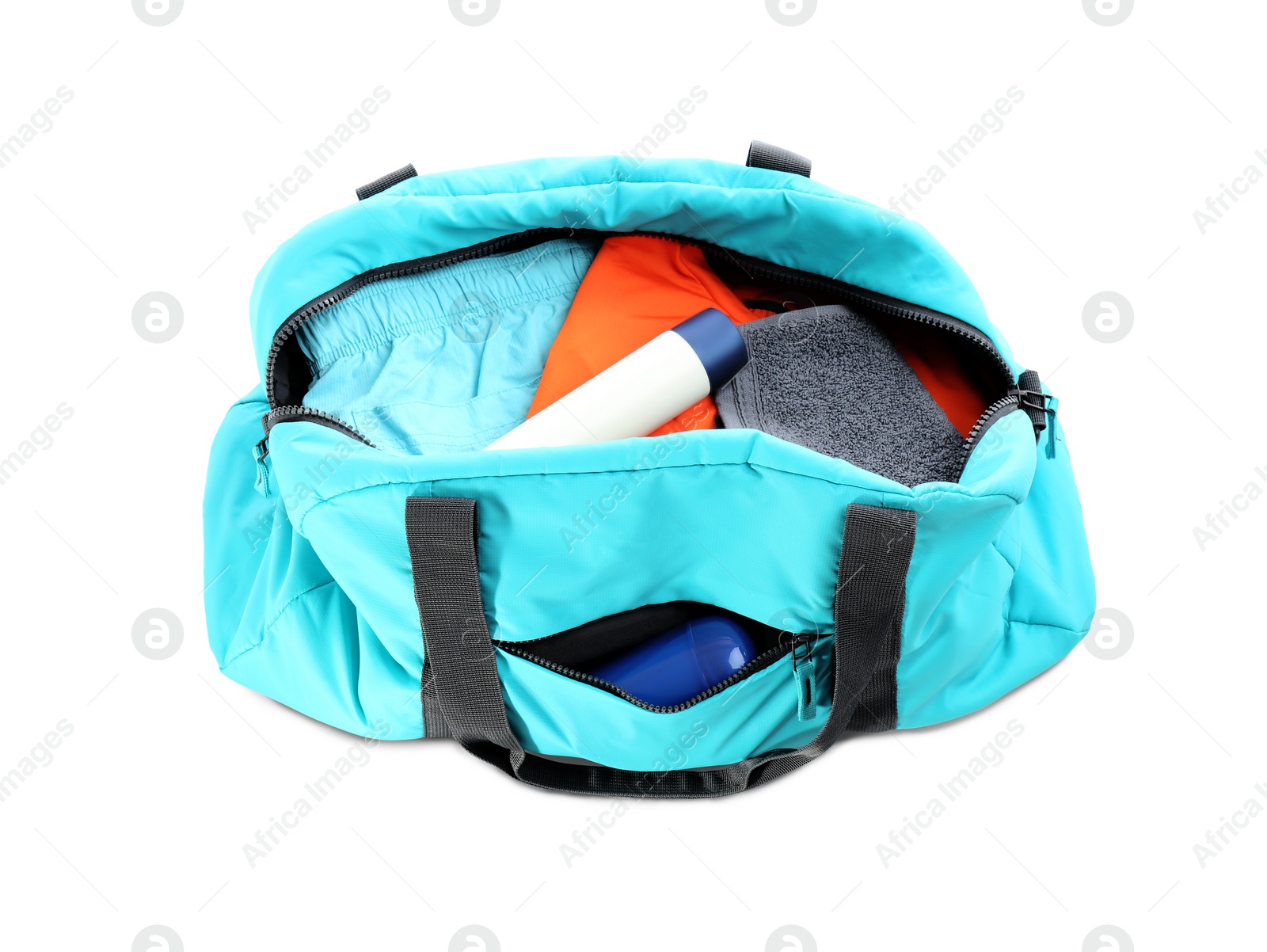 Photo of Sport bag with deodorants and clothes on white background