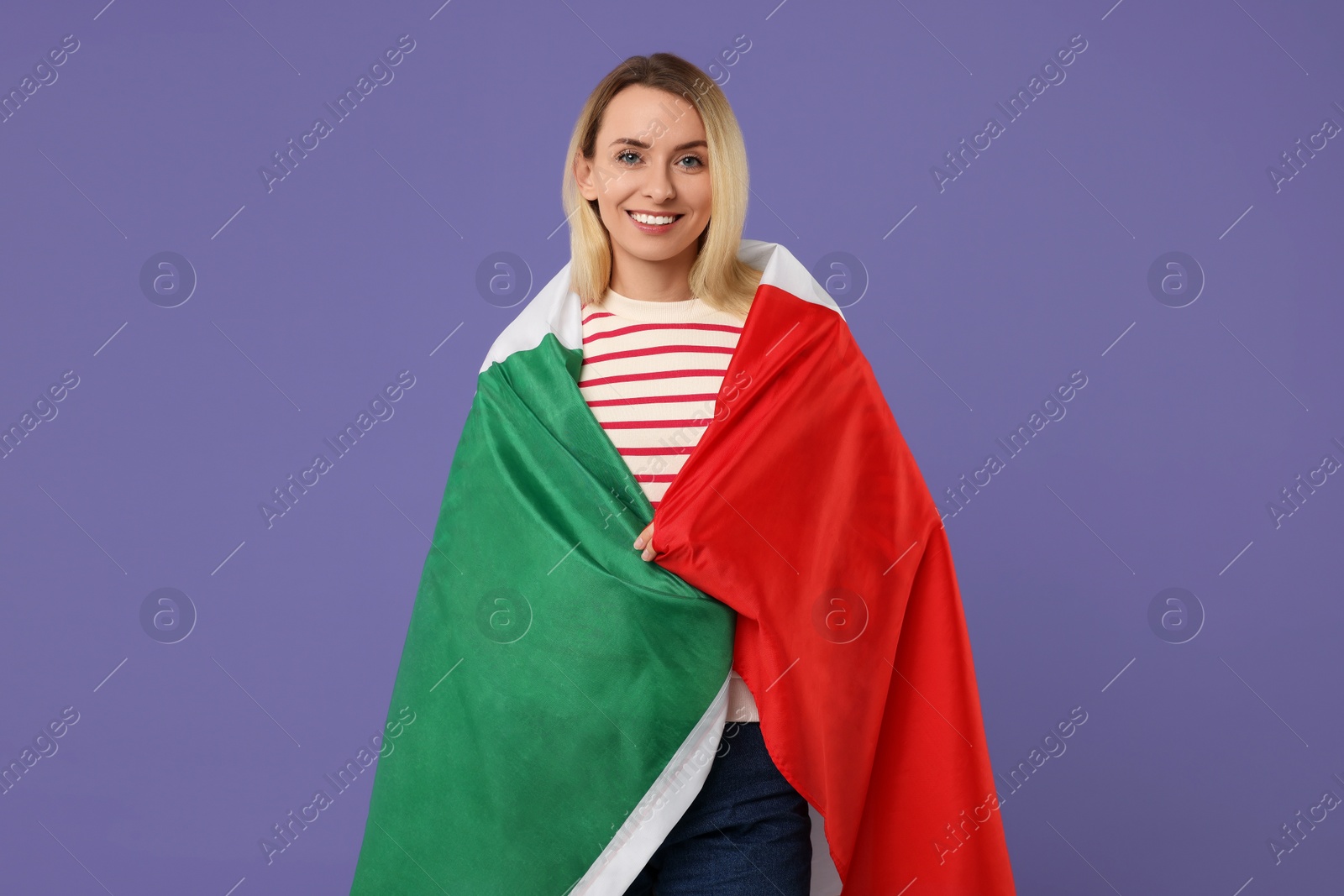 Photo of Happy woman with flag of Italy on violet background