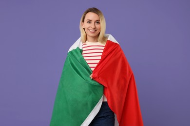 Happy woman with flag of Italy on violet background